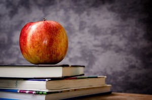 an apple on a pile of books